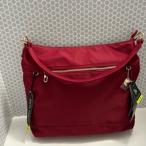 Travelon Nylon & Vegan Leather Red Tote with Ant-Theft Technology. 

NWT